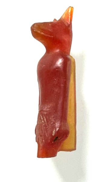 Picture of ANCIENT EGYPT. NEW KINGDOM. UPPER HALF CARNELIAN  AMULET OF ANUBIS.  1400 - 1200 B.C