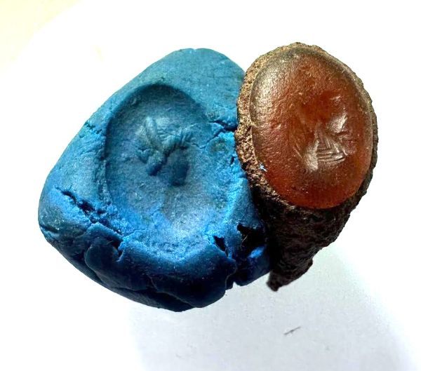 Picture of ANCIENT EGYPT.  ROMANO-EGYPT CARNELIAN INTAGLIO. IN THE FRAGMENT OF AN IRON RING  . FEMALE.  100 - 200  A.D