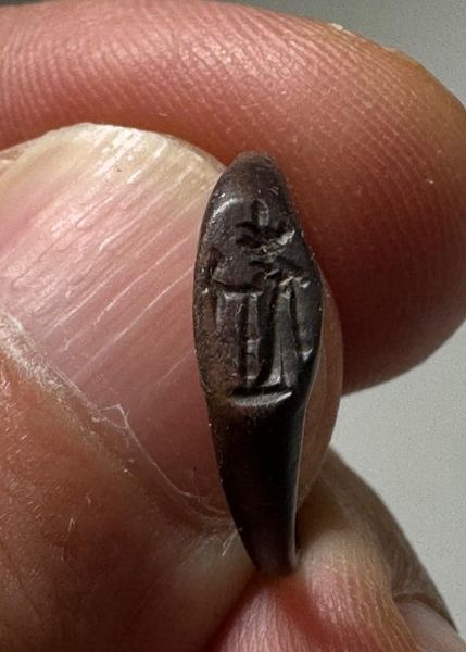 Picture of  Roman Egypt. 2nd-3rd century AD. Bronze seal ring. Incuse Isis standing l., holding sistrum.