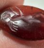 Picture of Greco-Roman stone intaglio. 1st century BC/AD. 16 x 10 mm. Incuse winged Nike standing r., extending both arms.