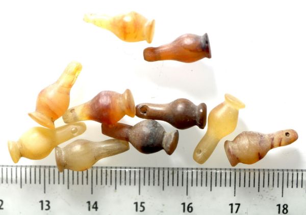 Picture of DEALER'S LOT:  ANCIENT EGYPT . LOT OF 10 CARNELIAN POPPY SEED AMULET. 1200 B.C .  NEW KINGDOM