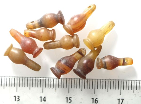 Picture of EALER'S LOT:  ANCIENT EGYPT . LOT OF 10 CARNELIAN POPPY SEED AMULET. 1200 B.C . NEW KINGDOM