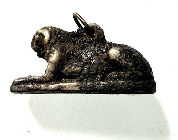 Picture of ANCIENT EGYPT. NEW KINGDOM SOLID SILVER RECLINING LION  AMULET. 1250 B.C 