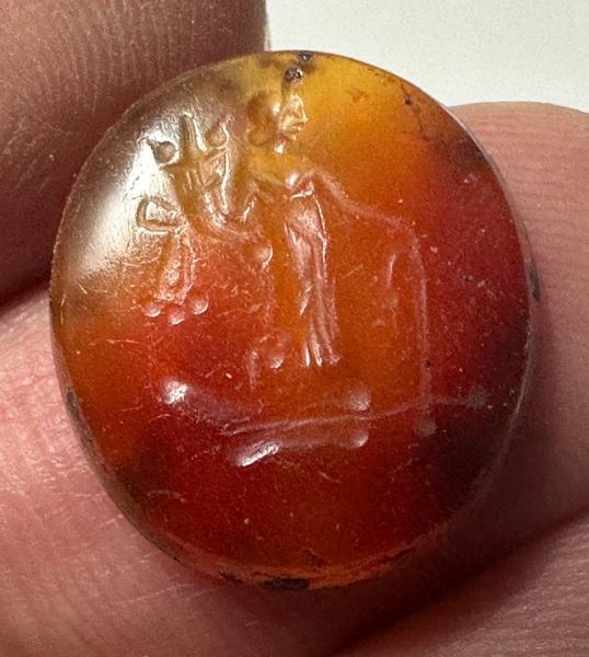 Picture of Greco-Roman stone intaglio (16 x 14 mm). 1st century BC/AD. Incuse Tyche standing r., holding filleted cornucopia and rudder.