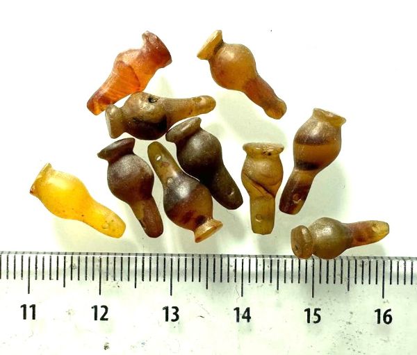 Picture of  ANCIENT EGYPT . LOT OF 10 CARNELIAN POPPY SEED AMULET. 1200 B.C  NEW KINGDOM