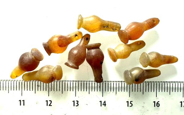 Picture of  ANCIENT EGYPT . LOT OF 10 CARNELIAN POPPY SEED AMULET. 1200 B.C  NEW KINGDOM