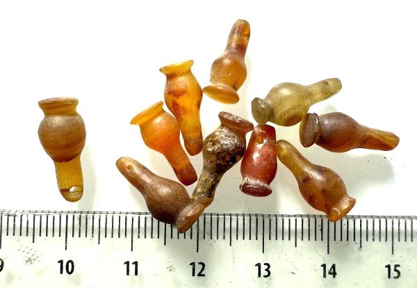 Picture of  ANCIENT EGYPT . LOT OF 10 CARNELIAN POPPY SEED AMULET. 1200 B.C  NEW KINGDOM