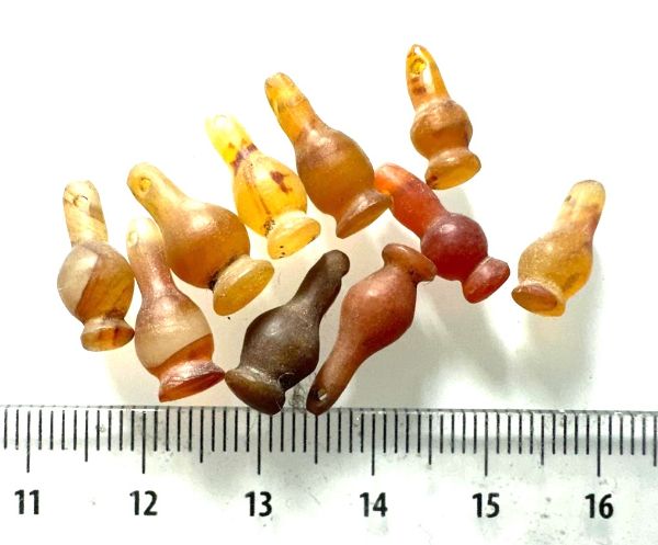 Picture of  ANCIENT EGYPT . LOT OF 10 CARNELIAN POPPY SEED AMULET. 1200 B.C  NEW KINGDOM