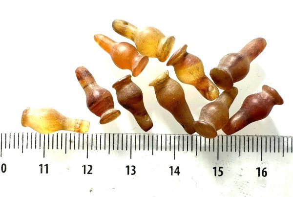 Picture of  ANCIENT EGYPT . LOT OF 10 CARNELIAN POPPY SEED AMULET. 1200 B.C  NEW KINGDOM