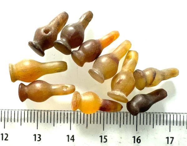 Picture of  ANCIENT EGYPT . LOT OF 10 CARNELIAN POPPY SEED AMULET. 1200 B.C  NEW KINGDOM