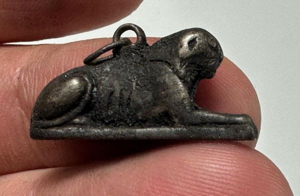 Picture of ANCIENT EGYPT. NEW KINGDOM SOLID SILVER RECLINING LION  AMULET. 1250 B.C 