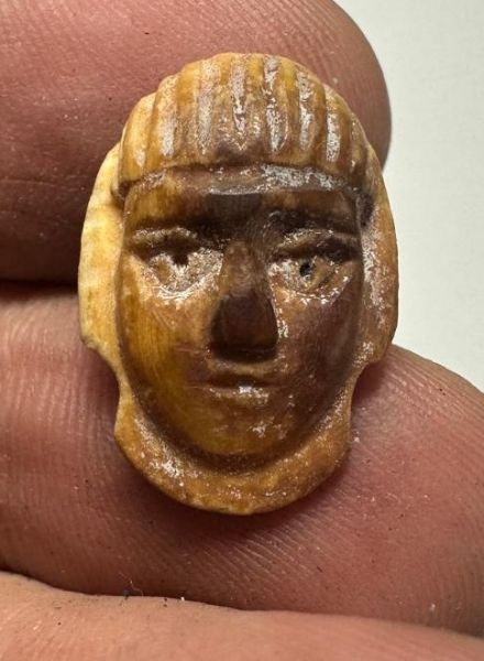 Picture of ANCIENT EGYPT.  NEW KINGDOM IVORY BUTTON . MALE'S FACE. 1400 - 1200  BC .   