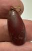 Picture of  ANCIENT EGYPT. NEW KINGDOM TEAR DROP CARNELIAN AMULET / BEAD WITH ORIGINAL GOLD SUSPENSION LOOP . 1400 - 1200 B.C