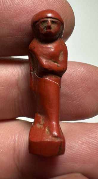 Picture of ANCIENT EGYPT, NEW KINGDOM RED JASPER . MALE STANDING  AMULET. 1400 - 1200 B.C