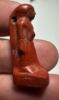 Picture of ANCIENT EGYPT, NEW KINGDOM RED JASPER . MALE STANDING  AMULET. 1400 - 1200 B.C