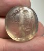 Picture of Greek. 450 - 300 B.C.  Rock crystal scarboid seal (21 x 19 x 8 mm). Pierced for string. Incuse Zeus(?) 