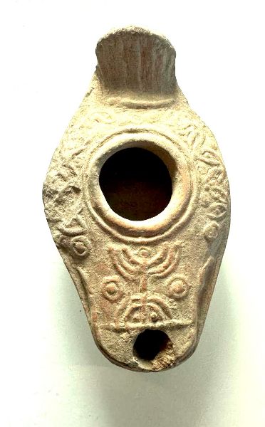 Picture of JUDAEA. Late Roman to Byzantine era, circa 400-500 CE. Ceramic  oil lamp with a Menorah