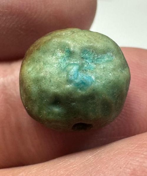 Picture of  ANCIENT EGYPT. FAIENCE BEAD /  SCARABOID. BES? .  600 - 300 B.C