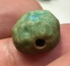 Picture of  ANCIENT EGYPT. FAIENCE BEAD /  SCARABOID. BES? .  600 - 300 B.C