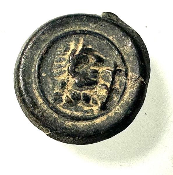 Picture of Roman. 3rd to 4th century AD.  Bronze button with Helios? 