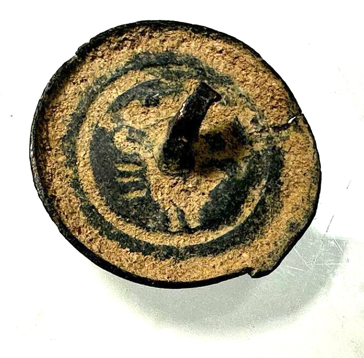 Roman. 3rd to 4th century AD. Bronze button with Helios?