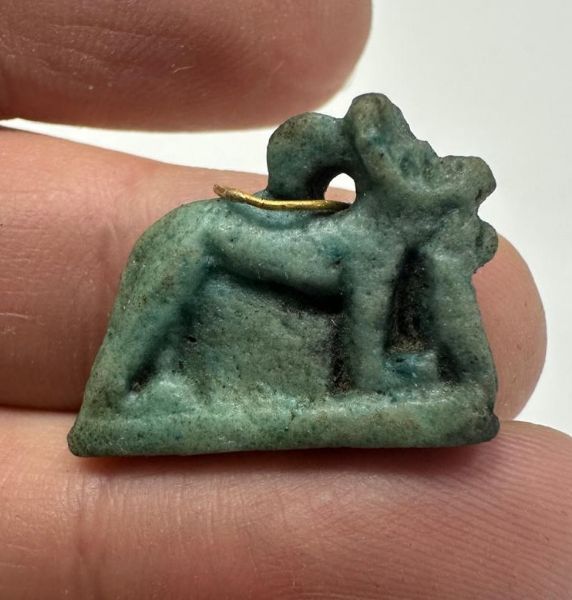 Picture of ANCIENT EGYPT. 26TH DYNASTY. FAIENCE ANUBIS (JACKAL) AMULET WITH THE ORIGINAL ANCIENT GOLD LOOP. 600 - 300 B.C
