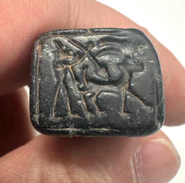Picture of   Ancient Levant. Northern Syria. Black Stone seal. 1000 B.C . Hunting scene 