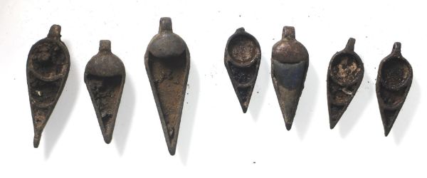 Picture of   Ancient Egypt. A group of 7 Different silver Pendant amulets. Ptolemaic Period. 