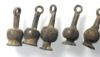 Picture of Ancient Egypt. A group of 7  silver Poppy seed amulets. Ptolemaic Period.