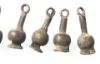 Picture of Ancient Egypt. A group of 7  silver Poppy seed amulets. Ptolemaic Period.