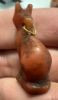 Picture of ANCIENT EGYPT. LATE PERIOD. STONE AMULET OF A CAT WITH THE ORIGINAL GOLD LOOP. 600 - 300 B.C