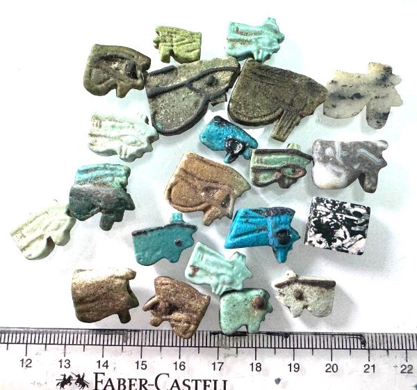 Picture of ANCIENT EGYPT -  LOT OF 21 FAIENCE AND STONE EYE OF HORUS AMULETS. 600  B.C - 100 A.D