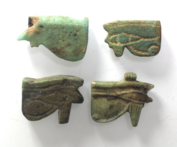 Picture of ANCIENT EGYPT - LOT OF 4 FAIENCE EYE OF HORUS AMULETS. 600 - 300 B.C