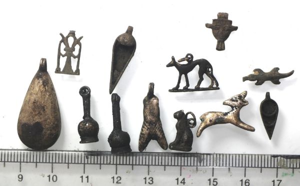 Picture of   Ancient Egypt. A group of 12  silver  amulets. LATE  Period. 3rd century B.C