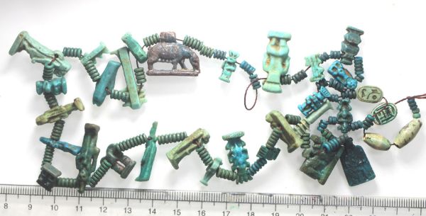 Picture of   Ancient Egypt. A RECENTLY STRUNG NECKLACE CONTAINING 30 AMULETS AND FAIENCE BEADS NEW KINGDOM TO ROMAN PERIOD. 1400 - 100 A.D