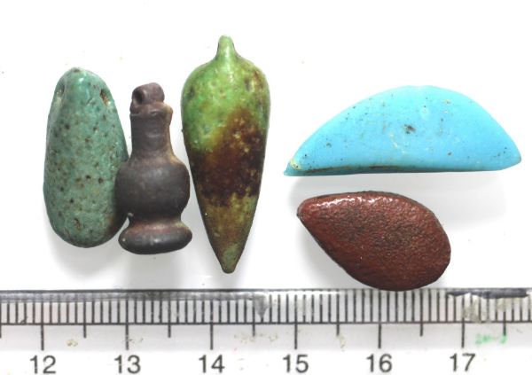 Picture of   Ancient Egypt. LOT OF 4  FAIENCE AMULETS AND A GLASS EYE. 600 - 100 B.C