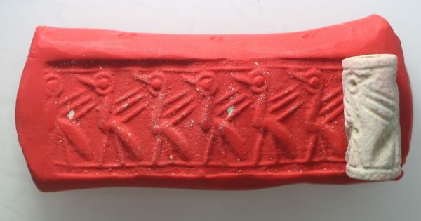Picture of  Ancient Egypt.   SECOND INTERMEDIATE PERIOD. FAIENCE CYLINDER SEAL. 1780 - 1550 B.C