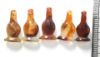 Picture of  Ancient Egypt. LOT OF 5 CARNELIAN STONE POPPY SEED AMULETS. 600 - 300 B.C