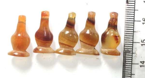 Picture of  Ancient Egypt. LOT OF 5 CARNELIAN STONE POPPY SEED AMULETS. 600 - 300 B.C