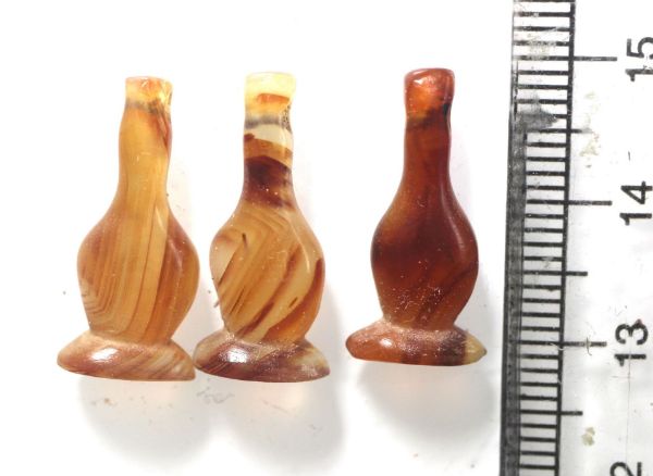 Picture of   Ancient Egypt. LOT OF 3 CARNELIAN STONE POPPY SEED AMULETS. 600 - 300 B.C