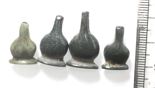 Picture of   Ancient Egypt. LOT OF  GREEN STONE  POPPY SEED AMULETS. 600 - 300 B.C