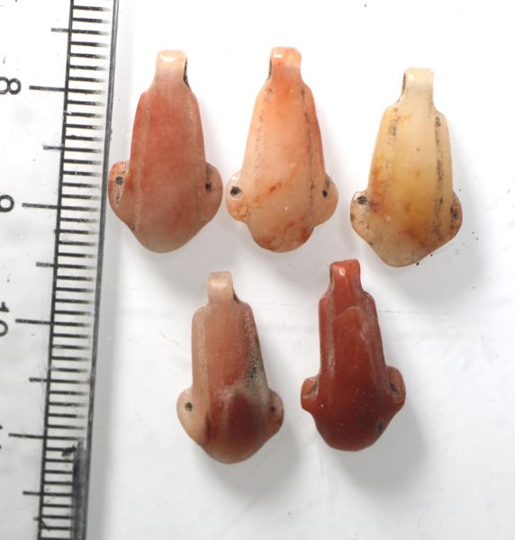 Picture of   Ancient Egypt. LOT OF 5 CARNELIAN LOTUS FLOWER  AMULETS. 600 - 300 B.C